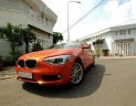 BMW 1 Series  116i  2014 - Chính chủ bán BMW 1 Series 116i đời 2014, màu cam