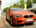 BMW 1 Series  116i  2014 - Chính chủ bán BMW 1 Series 116i đời 2014, màu cam