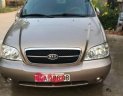 Kia Carnival 2009 - Bán Kia Carnival 2009, màu vàng  