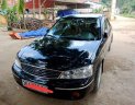 Ford Laser Ghia 1.8 MT 2004 - Bán xe Ford Laser Ghia 1.8 MT sản xuất năm 2004, màu đen, 200 triệu