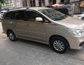 Toyota Innova E 2013 - Bán ô tô Toyota Innova E sản xuất năm 2013, màu vàng số sàn