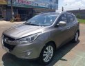 Hyundai Tucson 2.0 AT 4WD 2011 - Cần bán gấp Hyundai Tucson 2.0 AT 4WD 2011, màu nâu, xe nhập, 539 triệu