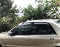 Ford Laser GHIA 1.8 MT 2003 - Bán xe Ford Laser GHIA 1.8 MT sản xuất 2003, màu vàng cát