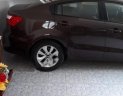 Kia Rio 1.4 AT 2015 - Cần bán gấp Kia Rio 1.4 AT sản xuất năm 2015, màu nâu, nhập khẩu