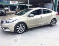 Kia K3 2014 - Cần bán gấp Kia K3 năm sản xuất 2014, màu vàng