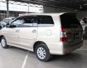 Toyota Innova E 2.0MT 2014 - Cần bán xe Toyota Innova E 2.0MT sản xuất 2014, màu vàng