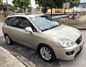 Kia Carens SXAT 2011 - Bán Kia Carens SXAT 2011, màu vàng