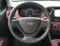 Hyundai Grand i10  1.2 AT 2016 - Cần bán lại xe Hyundai Grand i10 1.2 AT đời 2016, màu trắng, xe nhập