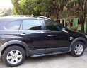 Chevrolet Captiva LT 2.4 MT 2009 - Cần bán gấp Chevrolet Captiva LT 2.4 MT năm 2009, màu đen