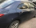 Toyota Corolla altis 1.8 2014 - Bán xe Toyota Corolla altis 1.8 đời 2014, màu xanh lam số tự động giá cạnh tranh