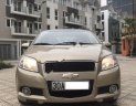 Chevrolet Aveo LT 1.5 MT 2014 - Cần bán gấp Chevrolet Aveo 1.5MT sản xuất 2014, màu vàng xe gia đình