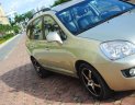 Kia Carens 2.0 2009 - Cần bán Kia Carens 2.0 sx 2009, màu vàng