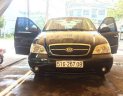 Kia Carnival 2009 - Cần bán gấp Kia Carnival năm sản xuất 2009, màu đen 