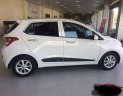 Hyundai Grand i10  1.2 2015 - Cần bán Hyundai Grand i10 năm 2015, màu trắng, số tự động