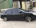 Mitsubishi Lancer   1.8AT  2003 - Bán Mitsubishi Lacer 1.8 AT 2003 màu đen, odo 108.000 Km