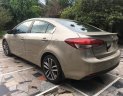 Kia Cerato AT 2016 - Cần bán Kia Cerato AT sản xuất 2016, màu nâu 