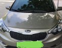 Kia K3 2014 - Cần bán Kia K3 đời 2014, màu vàng