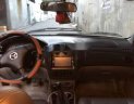 Mazda 323 2004 - Gia đình bán Mazda 323 2004, màu đen, 150tr