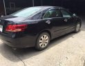 Toyota Camry 2.4G 2009 - Cần bán xe Toyota Camry 2.4G sản xuất năm 2009, màu đen còn mới, giá tốt