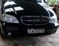 Kia Carnival GS 2.5 MT 2006 - Bán Kia Carnival GS 2.5 MT sản xuất 2006, màu đen, xe gia đình