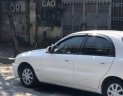 Daewoo Lanos SX 2004 - Cần bán xe Daewoo Lanos SX sản xuất 2004, màu trắng 