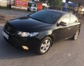 Kia Cerato 1.6 2010 - Bán ô tô Kia Cerato 1.6 đời 2010, màu đen, số tự động