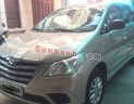 Toyota Innova   2.0E MT  2014 - Gia đình bán xe Toyota Innova 2.0E MT năm 2014, màu vàng cát