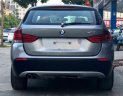 BMW X1 2010 - Bán xe BMW X1 sản xuất 2010 màu xám (ghi), giá 587 triệu, xe nhập