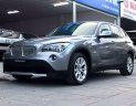 BMW X1 2010 - Bán xe BMW X1 sản xuất 2010 màu xám (ghi), giá 587 triệu, xe nhập