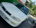 Mitsubishi Lancer  MT 2000 - Cần bán lại xe Mitsubishi Lancer MT năm sản xuất 2000, màu trắng, máy phun xăng không hao xăng