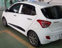 Hyundai Grand i10 1.2AT 2015 - Bán Hyundai Grand i10 1.2AT sản xuất 2015, màu trắng, nhập khẩu nguyên chiếc xe gia đình