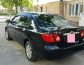 Toyota Corolla altis   2004 - Bán xe Toyota Corolla Altis, màu đen, đời 2004, số tay, nhiên liệu 7 lít, mới đi 12,0000 km