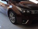 Toyota Corolla altis 1.8G MT 2015 - Bán Toyota Corolla altis 1.8G MT đời 2015, màu nâu, đẹp như mới