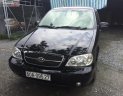 Kia Carnival 2006 - Bán Kia Carnival đời 2006, màu đen, nhập khẩu xe gia đình, giá tốt