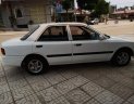 Mazda 323   1995 - Cần bán gấp Mazda 323 đời 1995, màu trắng, đèn trước sau mới thay, về chỉ việc đi