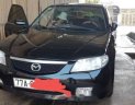 Mazda 323 2004 - Bán ô tô Mazda 323 sản xuất 2004, màu đen chính chủ, giá 145tr