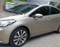 Kia K3 1.6 AT  2013 - Bán Kia K3 1.6 AT số tự động model 2014, Sx 2013, màu vàng 1 đời chủ mới 90%