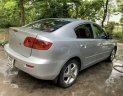 Mazda 3 AT 2004 - Cần bán lại xe Mazda 3 AT sản xuất năm 2004, màu bạc