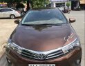 Toyota Corolla altis AT 2015 - Cần bán lại xe Toyota Corolla altis AT sản xuất 2015, màu nâu chính chủ