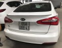 Kia K3 1.6MT 2014 - Bán Kia K3 1.6MT màu trắng, số sàn, sản xuất 2014, Đk 2015 một chủ đi 68000km