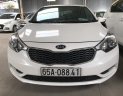 Kia K3 1.6MT 2014 - Bán Kia K3 1.6MT màu trắng, số sàn, sản xuất 2014, Đk 2015 một chủ đi 68000km