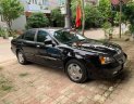 Daewoo Magnus   2004 - Cần bán lại xe cũ Daewoo Magnus năm 2004, màu đen