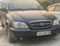 Kia Carnival LS 2.5 AT 2009 - Bán Kia Carnival LS 2.5 AT đời 2009, màu đen, số tự động