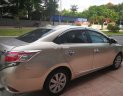 Toyota Vios 2015 - Cần bán lại xe Toyota Vios 2015, màu vàng chính chủ