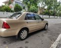 Ford Laser 2004 - Ford Laser 1.8 số tự động, vàng cát 2004