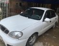 Daewoo Lanos SX 2002 - Cần bán gấp Daewoo Lanos SX đời 2002, màu trắng số sàn