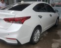 Hyundai Accent 1.4AT  2018 - Bán Hyundai Accent 1.4AT màu trắng số tự động, bản tiêu chuẩn, sản xuất cuối 2018, đi 10.000km