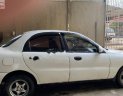 Daewoo Lanos SX 2002 - Cần bán gấp Daewoo Lanos SX đời 2002, màu trắng số sàn