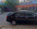 Toyota Corolla 2003 - Bán Toyota Corolla sản xuất năm 2003, màu đen xe gia đình