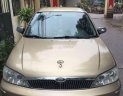 Ford Laser 2002 - Bán xe Ford Laser đời 2002, màu vàng cát